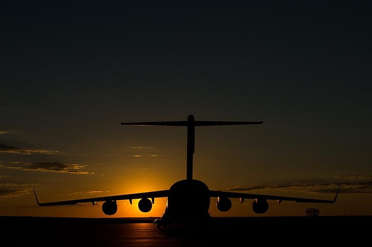 Aircraft silhouette at golden hour